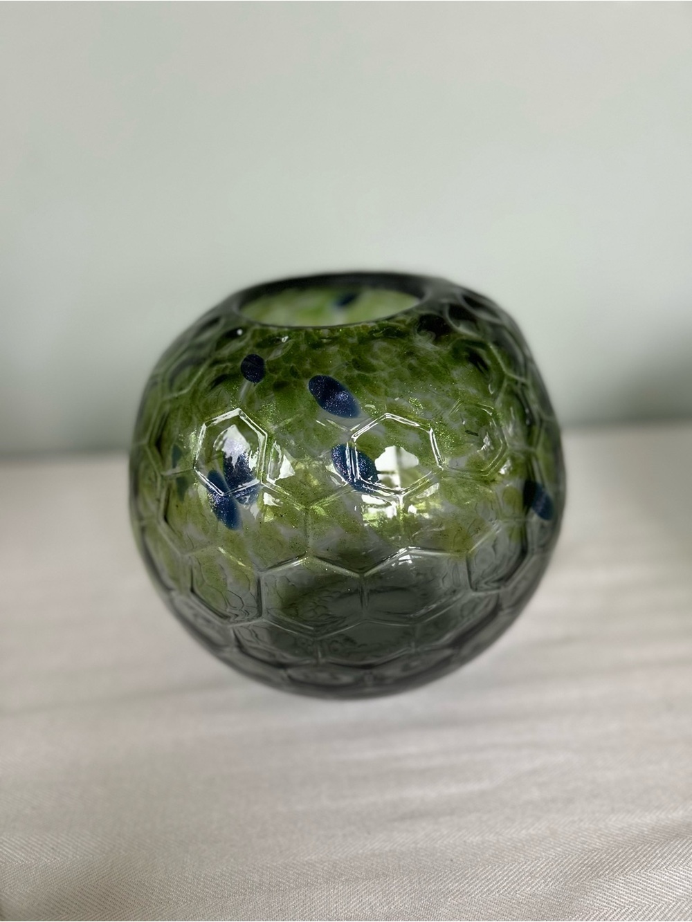 Green and blue glass rose bowl vase featuring a textured honeycomb pattern